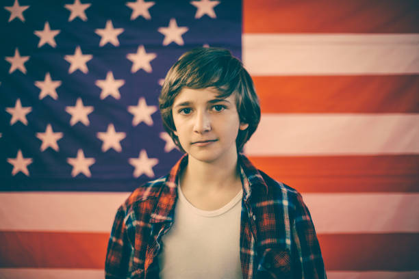 istock a boy in front of american flag 683653090