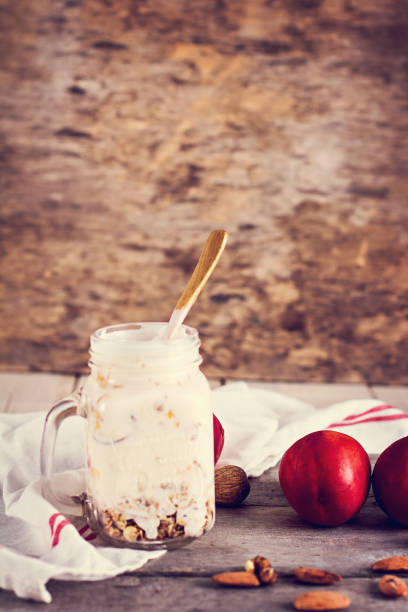 istock Granola with natural yoghurt, peaches and nuts 683671570