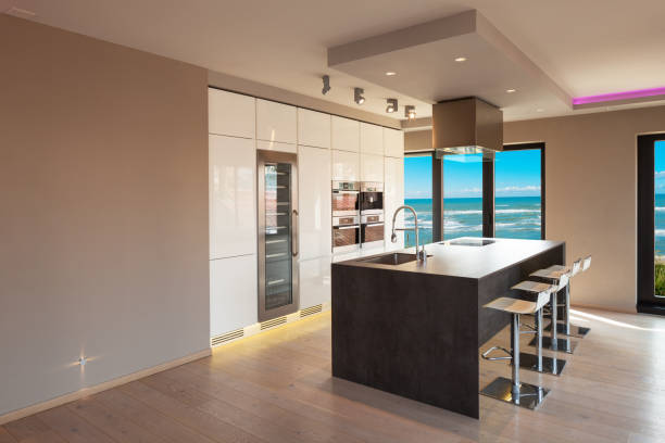 istock Interiors of a modern apartment, kitchen with sea view 683677676