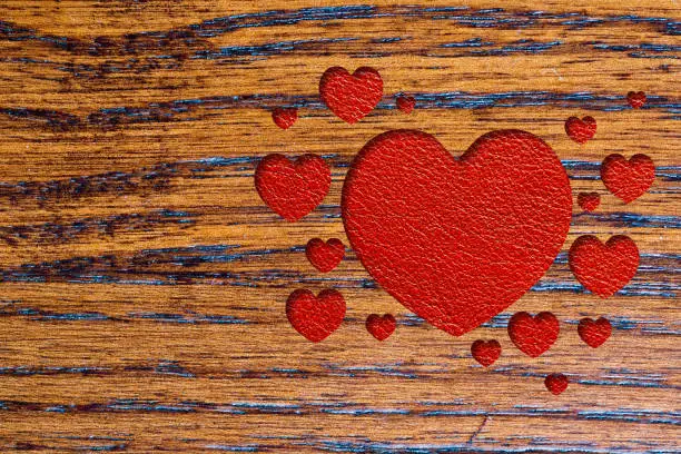 red hearts, wooden desk and leather