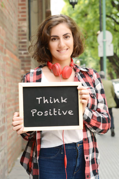 istock Woman holding chalkboard with text 
