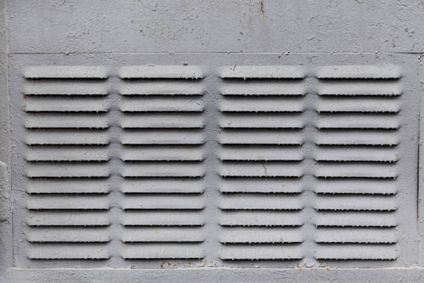 istock Array of ventilation grid slots in metal wall with paint drops 683681384
