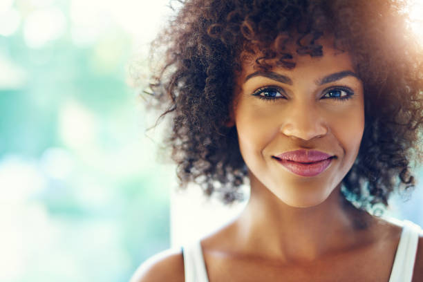 istock Smiling young black woman in sunshine 683687862
