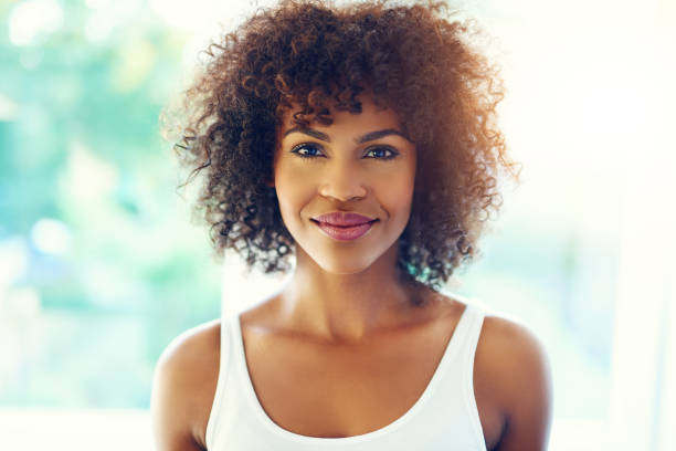 istock Grinning young black woman in sunshine 683688070