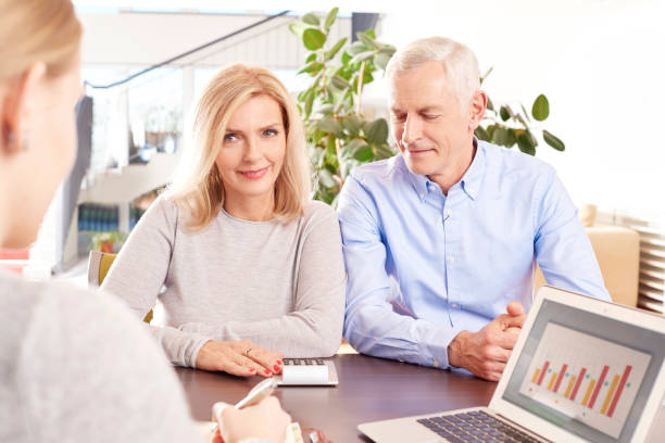 istock Investment advisor and her senior clients 683691322