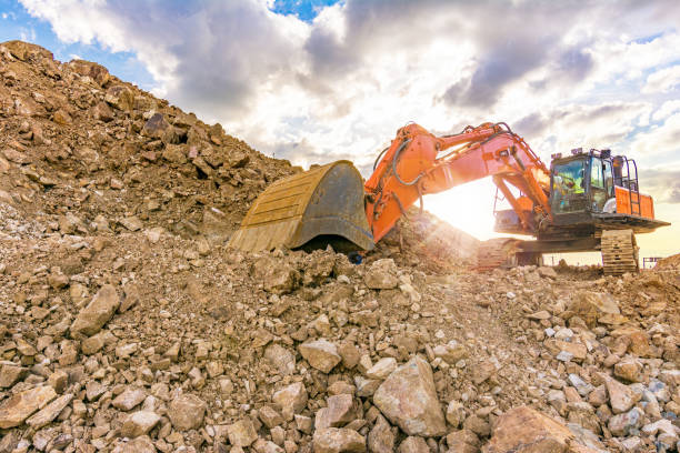 istock Outdoor quarry with heavy machinery 683694610