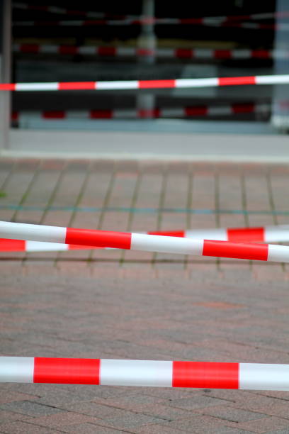 istock Security red and white fencing strips on the street. 683695302
