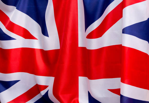 istock UK Flag flutters in the wind.The place to advertise, template. 683695430