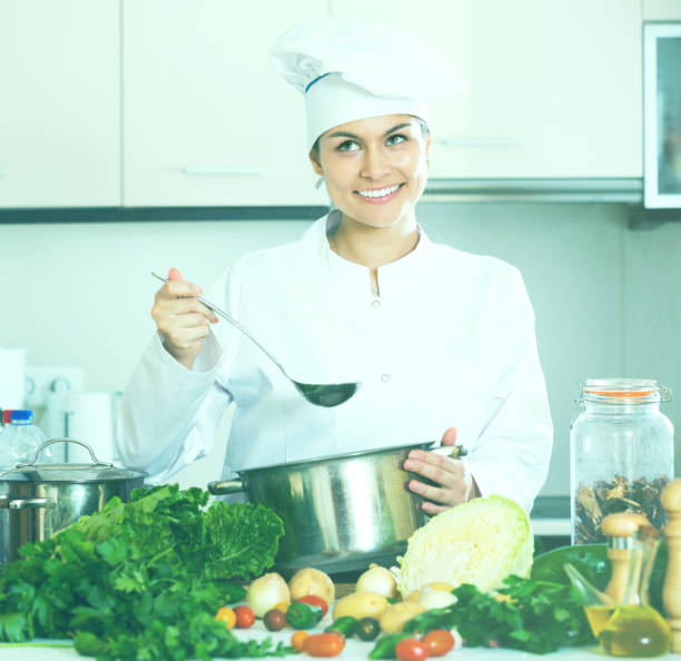 istock Woman in uniform at kitchen 683699988