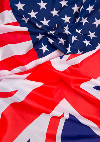 Bandera de Estados Unidos y el fondo de la bandera de Reino Unido. photo
