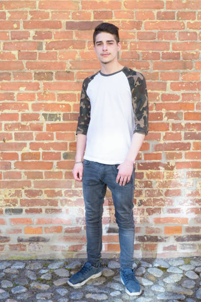 istock Portrait of handsome young man outdoors against brick wall 683702006