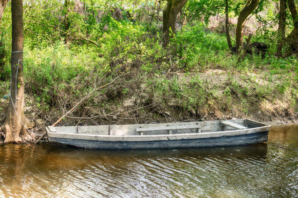 istock Boat in mountain stream in green forest at spring time 683702350