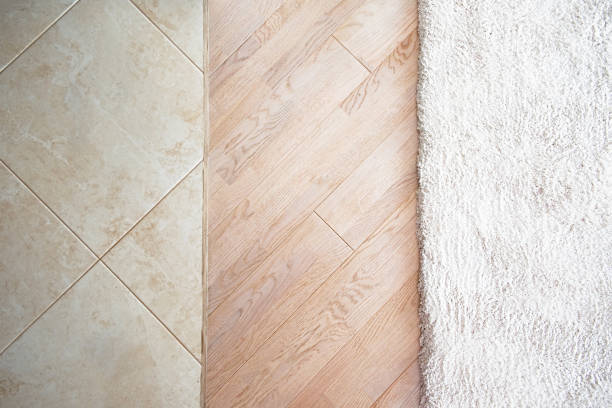 istock Floor with marble tile pattern, laminate parquete floor with beige soft carpet 683705298