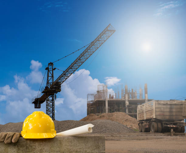 istock Construction industry building on high ground with yellow helmet and paper work 683706464