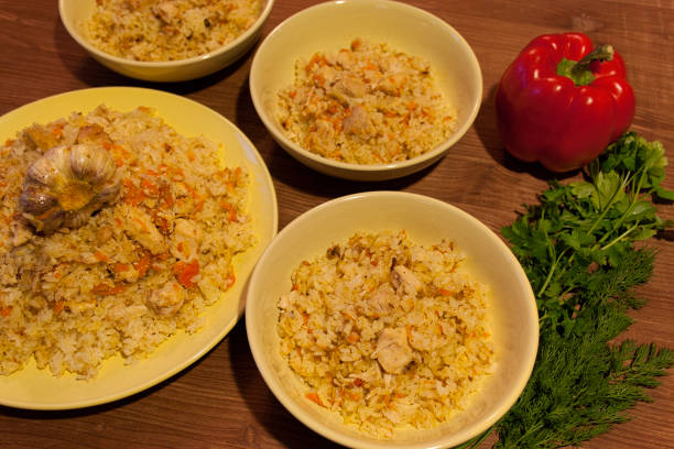 istock Pilaf on the clay plate on a wooden table. 683706866