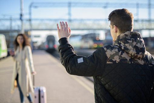 https://media.istockphoto.com/id/683708734/photo/separation-of-young-couple-woman-leaving-with-suitcase-at-train-station-platform-while.jpg?b=1&s=170667a&w=0&k=20&c=K5rzKKUl11jqTZrpAMrUQxh_INa5iwjq7YnaqSHryhE=