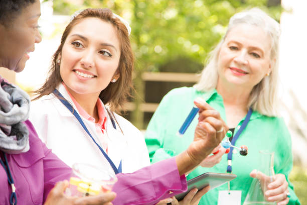 istock STEM themes with female scientists working on water project outdoors. 683716164