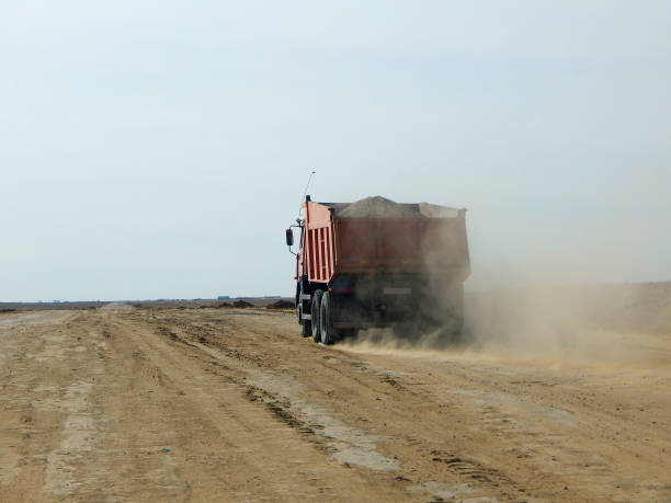 istock Dump truck on a dirt road. 683718634