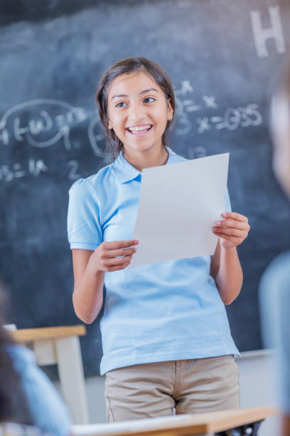 istock Cheerful Hispanic STEM student presents oral report 683722244