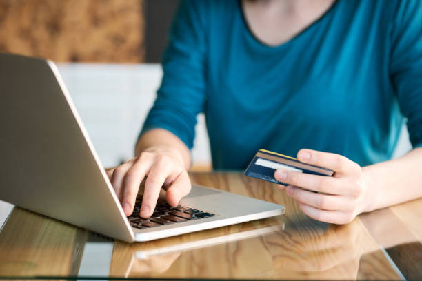 istock Woman paying online by creadit card 683733018