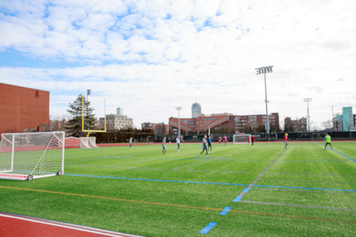 Boston, Massachusetts, USA   - October 9, 2023: An empty soccer field on Harvard University's Boston (Allston) campus.