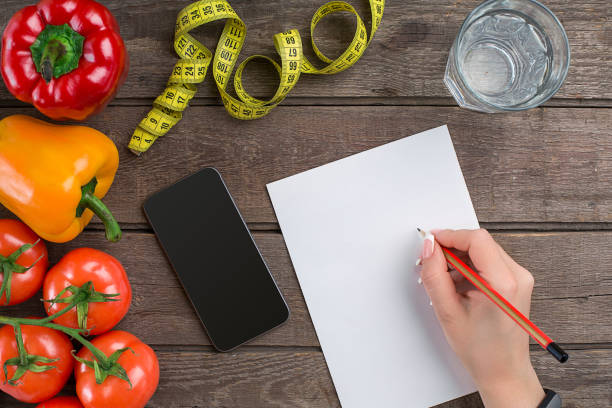 istock Concept diet, slimming plan with vegetables top view mock up 683737404