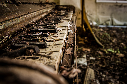 Tattered old abandoned piano