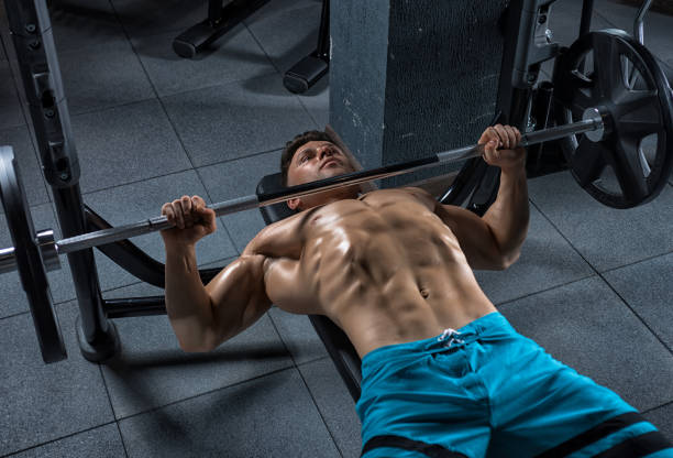 istock Young handsome guy doing exercises in the gym 683743850