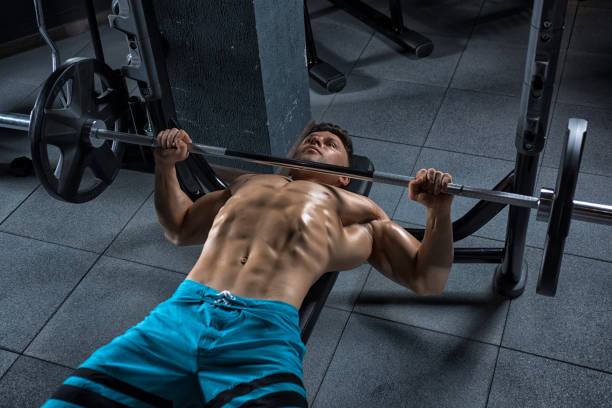 istock Young handsome guy doing exercises in the gym 683743858