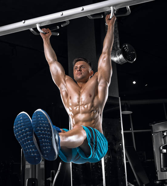 istock Young handsome guy doing exercises in the gym 683743874