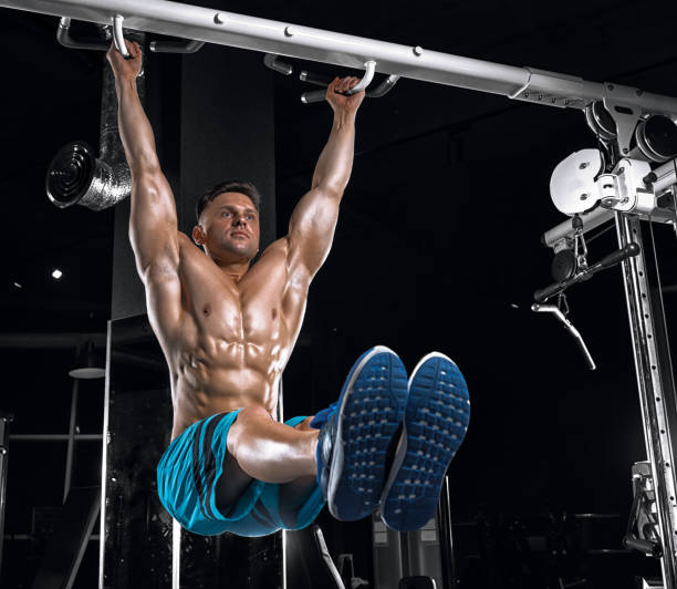 istock Young handsome guy doing exercises in the gym 683743884