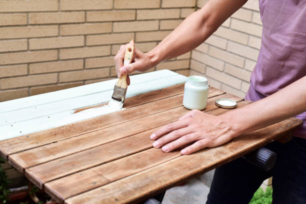 istock young man painting an old wooden table 683747720