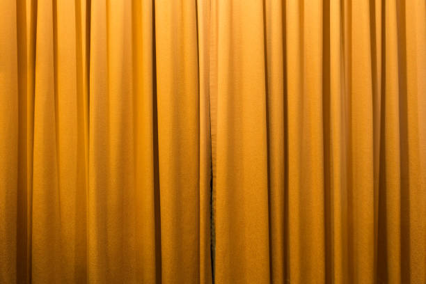 istock gold color curtain background texture 683751372