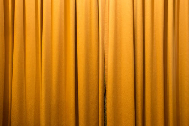 istock gold color curtain background texture 683751452