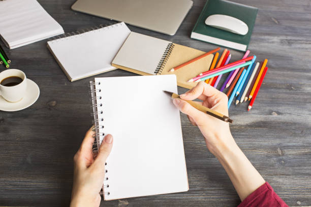 istock Woman writing in organizer 683751578