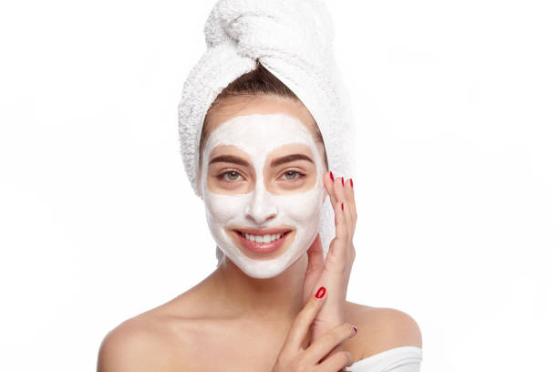 istock Young woman applying mask 683754228