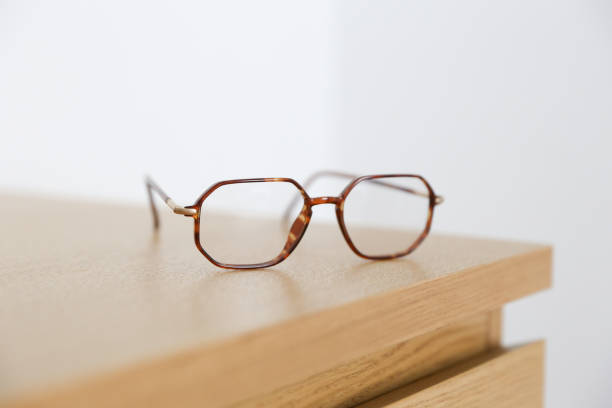 istock An eyeglasses on wooden table 683759768
