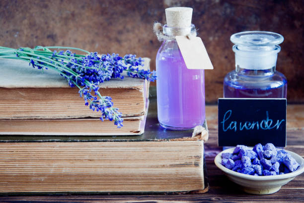 istock Lavender flowers, lavender essential and old books 683762202