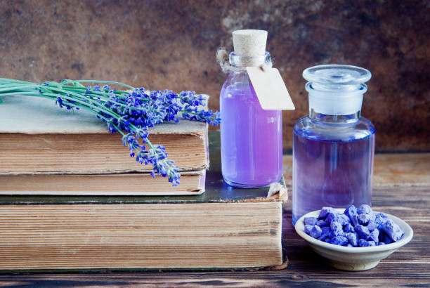 istock Lavender flowers, lavender essential and old books 683766104