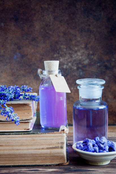 istock Lavender flowers, lavender essential and old books 683769218