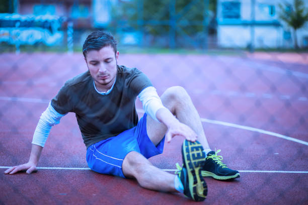istock Photo of a man stretching in the rain 683769926