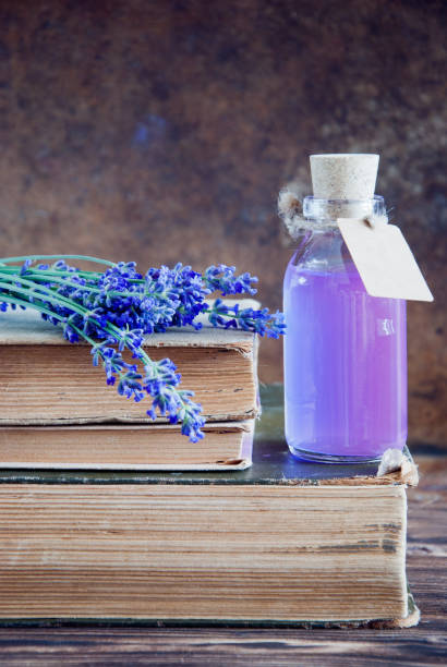 istock Lavender flowers, lavender essential and old books 683770018