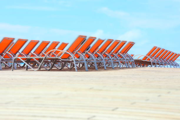 row of sun loungers on the beach row of sun loungers on the beach clearwater stock pictures, royalty-free photos & images