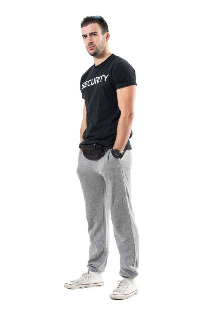 istock Profile view of serious muscular bouncer or bodyguard looking at camera skeptically 683777366
