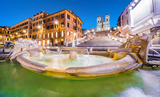 Fontana della Barcaccia fountain and Scalinata di Trinità dei Monti in Spanish Steps square in Rome. Italy