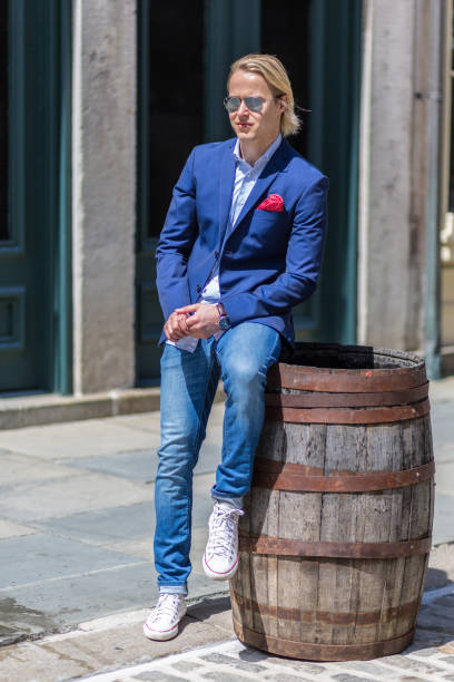 istock Blonde Haired Man Sitting On A Barrel 683784538