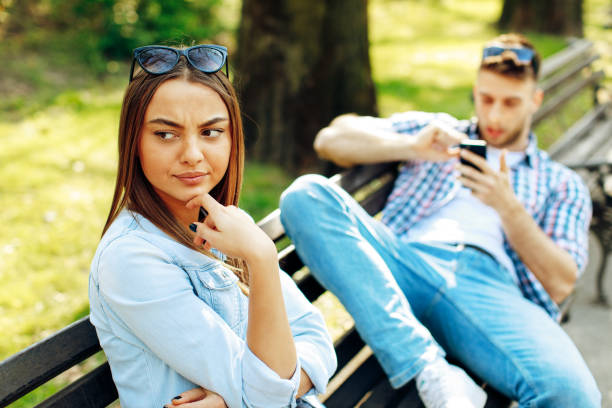 istock Man having fun with smartphone during a date with a beautiful woman 683784666