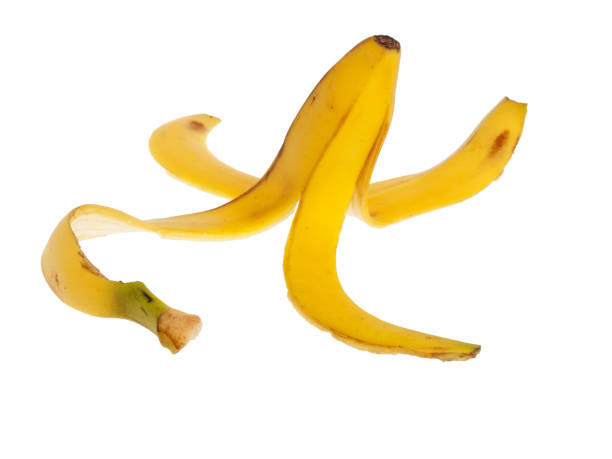 istock Slippery banana skin on a white background 683787424