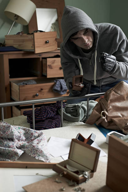 istock Burglar Stealing Items From Bedroom During House Break In 683789368