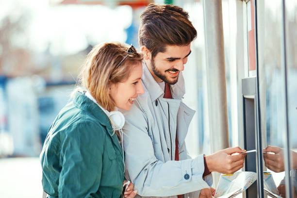 Love Couple Using ATM stock photo